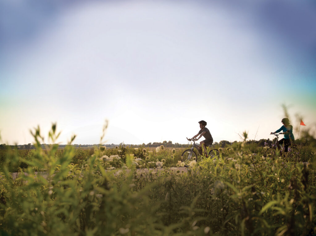 Two people riding bikes along the Frisco trail