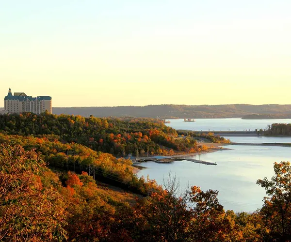 A large hotel overlooks Table Rock lake during the fall