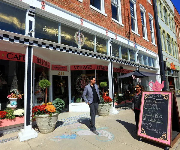 Man exiting a vintage shop on C Street