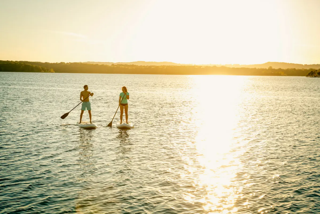 Two people stand up paddle boarding at Table Rock Lake